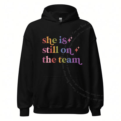She is Still on the Team Care & Resist Gildan hoodie in Black