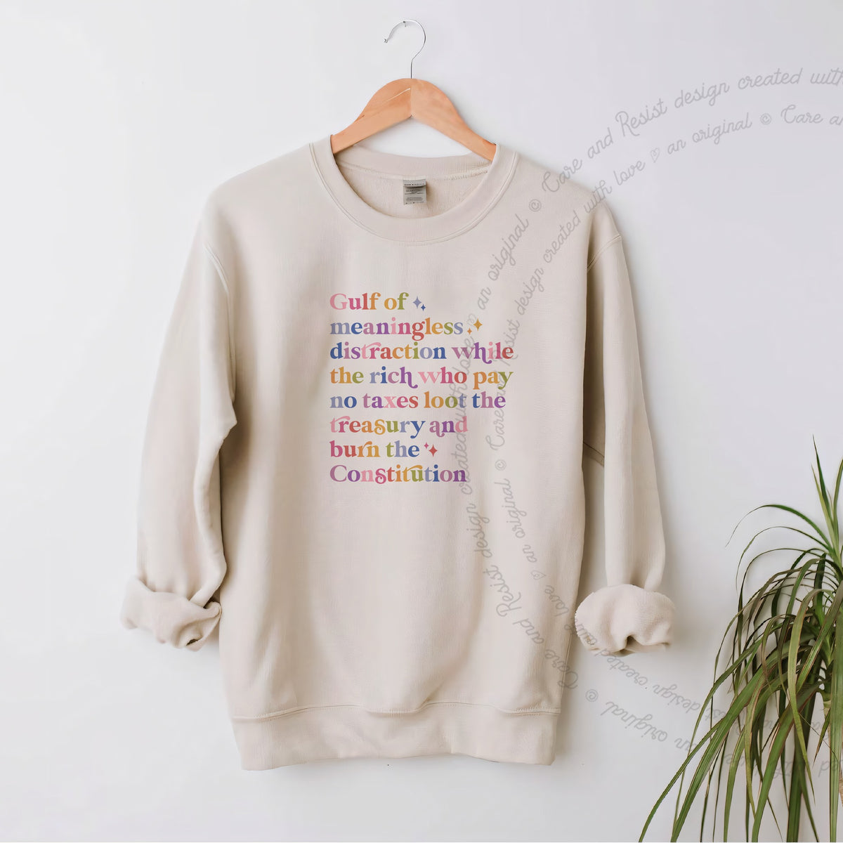 Gulf of Meaningless Distraction While the Rich Who Pay No Taxes Loot the Treasury and Burn the Constitution Care & Resist Gildan crewneck sweatshirt in Sand