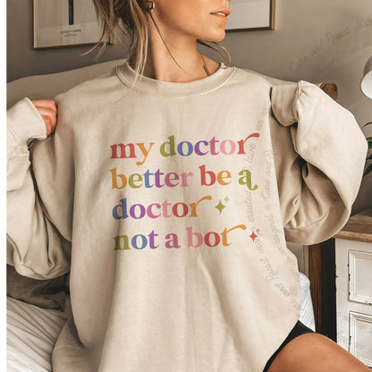 My Doctor Better Be a Doctor not a Bot Care & Resist Gildan crewneck sweatshirt in Sand