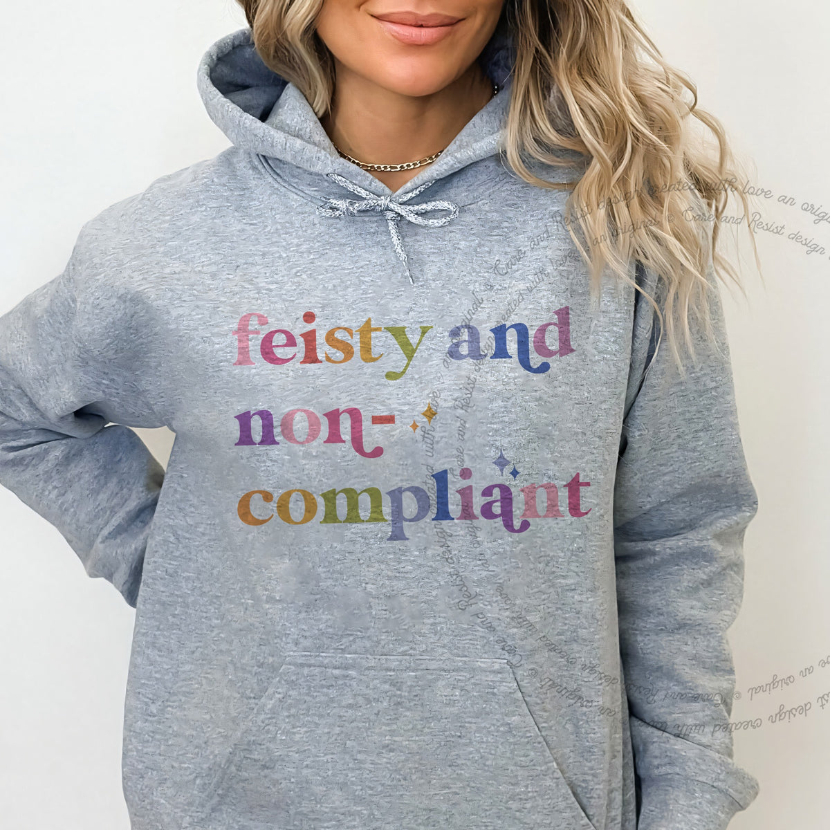 Feisty and Non-compliant Care & Resist Gildan hoodie in Sport Grey