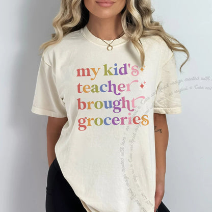 My Kid's Teacher Brought Groceries Care & Resist rainbow Comfort Colors tee, Ivory