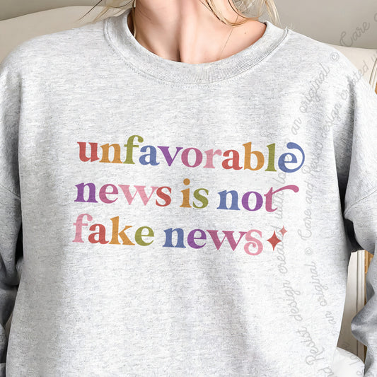 Unfavorable News is not Fake News Care & Resist Gildan crewneck sweatshirt in Sport Grey