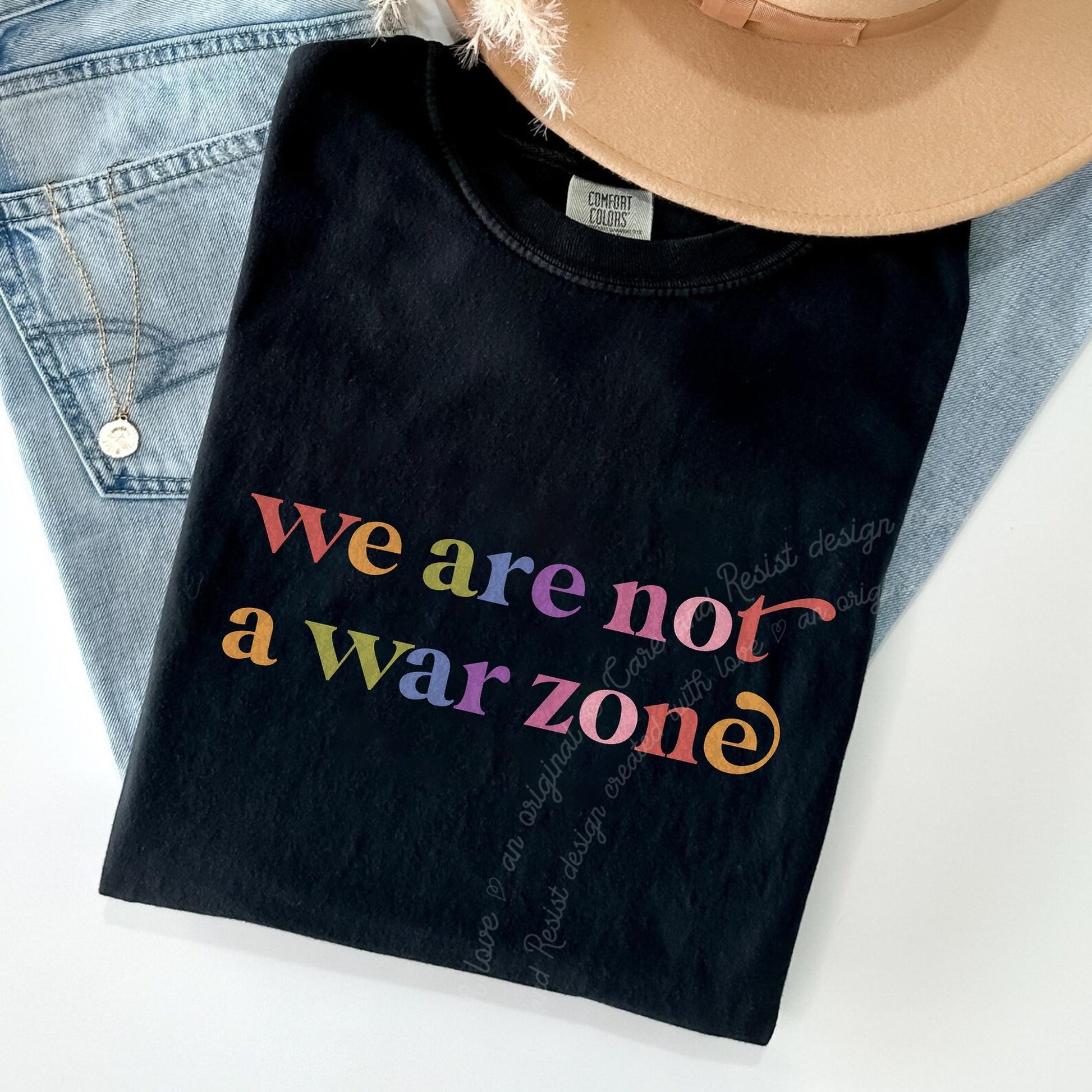 We are not a War Zone Care & Resist rainbow tee