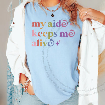My Aide Keeps Me Alive Care & Resist rainbow Comfort Colors tee, Chambray