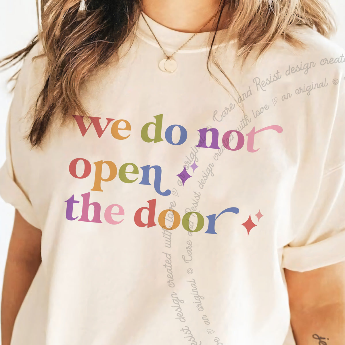 We Do not Open the Door Care & Resist progressive t-shirt in Ivory