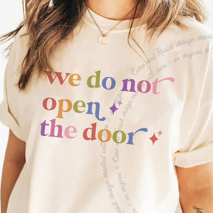 We Do not Open the Door Care & Resist progressive t-shirt in Ivory