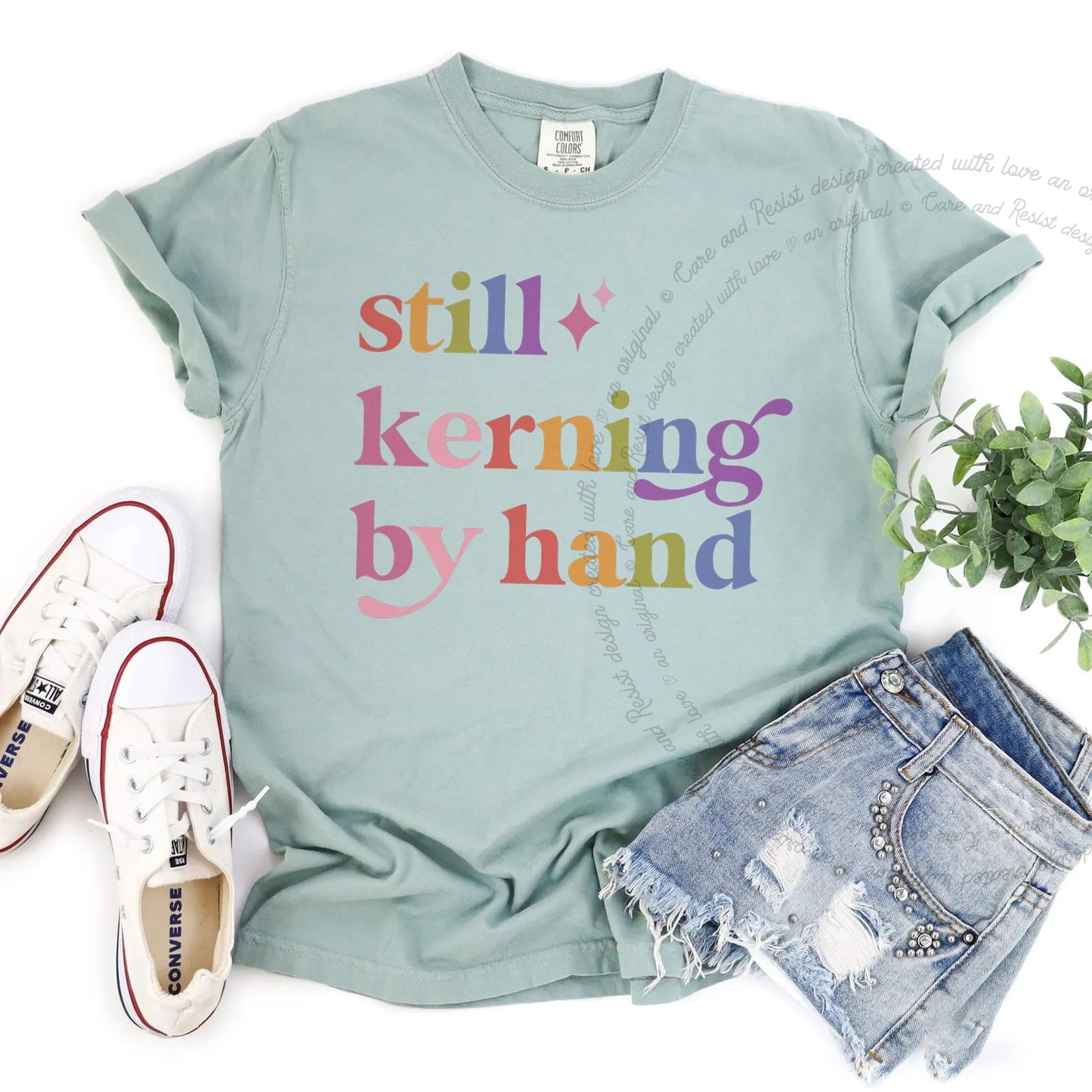 Still Kerning By Hand Care & Resist rainbow Comfort Colors tee, Bay