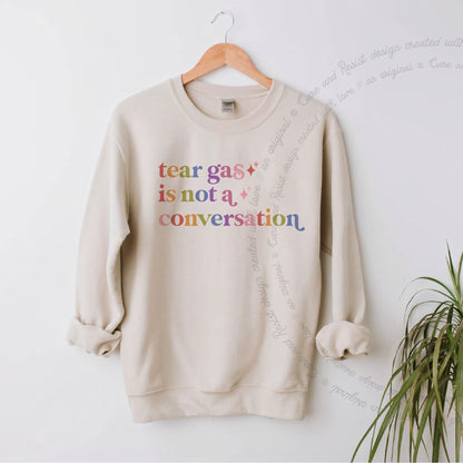 Tear Gas is not a Conversation Care & Resist Gildan crewneck sweatshirt in Sand