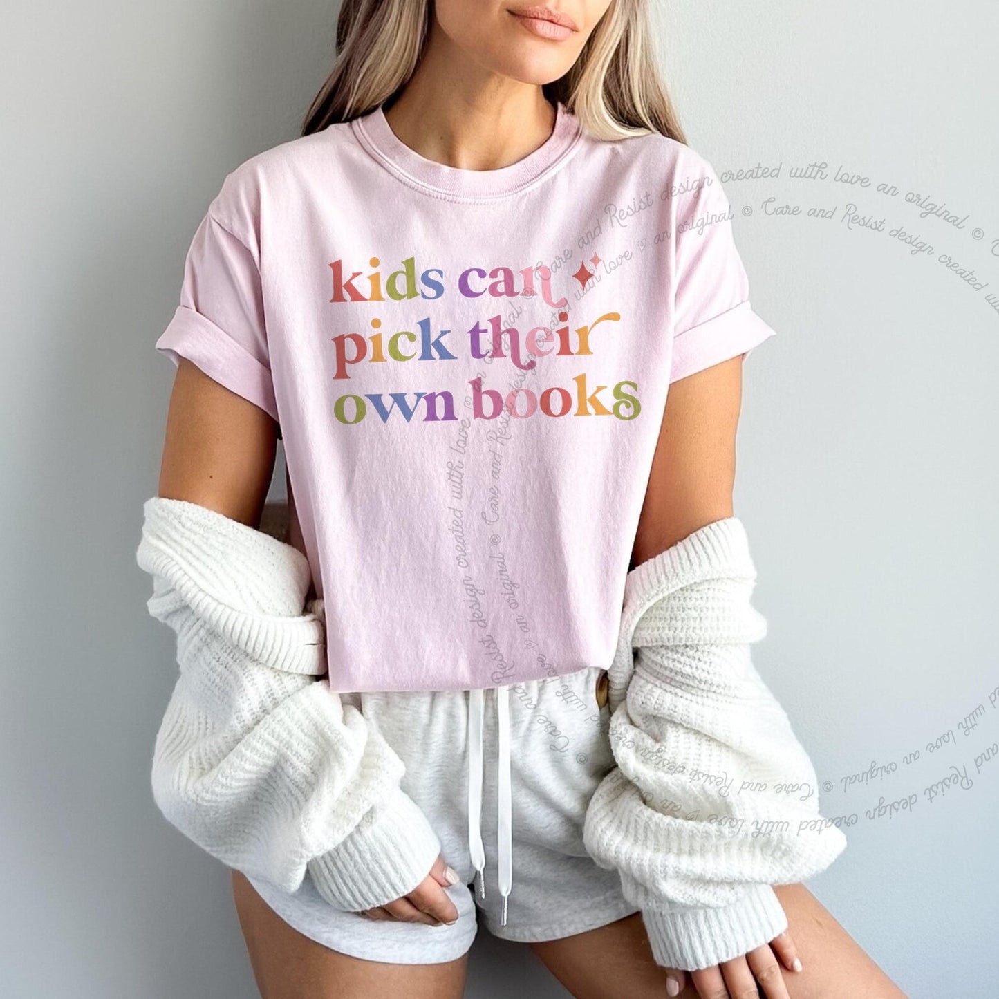Kids Can Pick Their Own Books Care & Resist rainbow Comfort Colors tee, Blossom