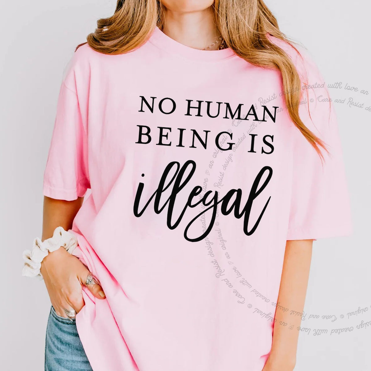 No Human Being Is Illegal Care & Resist progressive t-shirt in Blossom