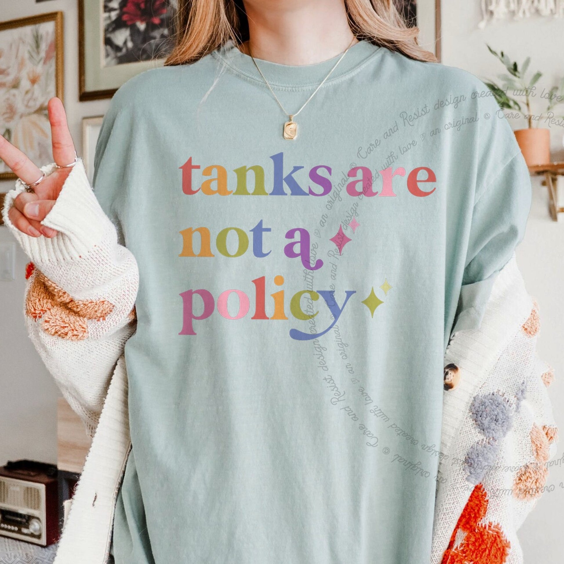 Tanks are not a Policy Care & Resist rainbow tee