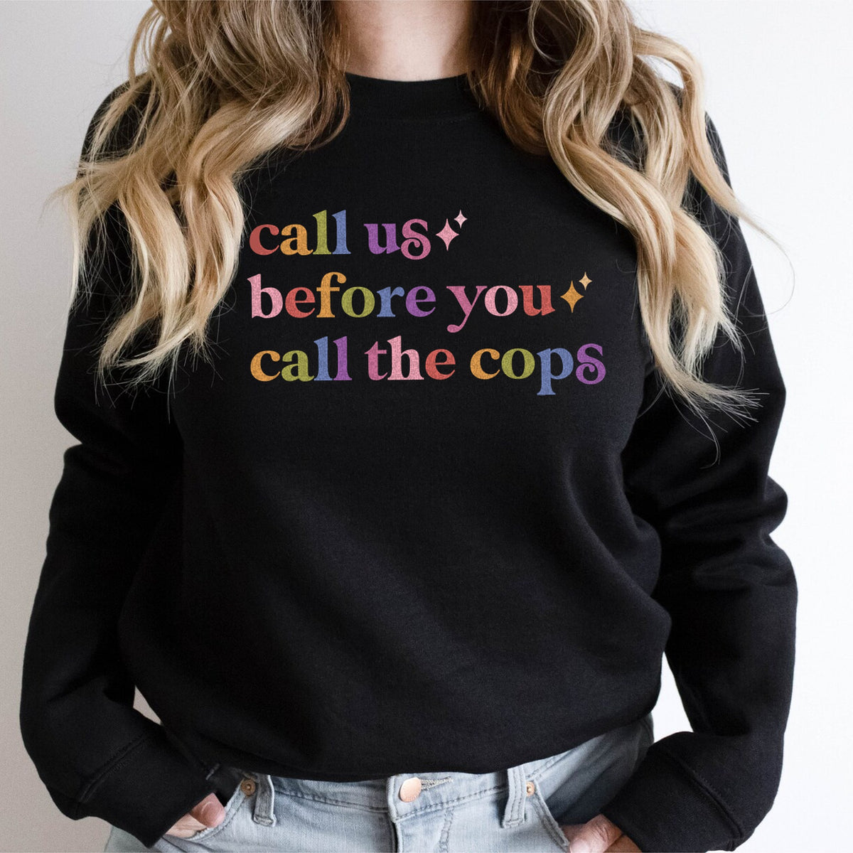 Call Us Before You Call the Cops Care & Resist Gildan crewneck sweatshirt in Black