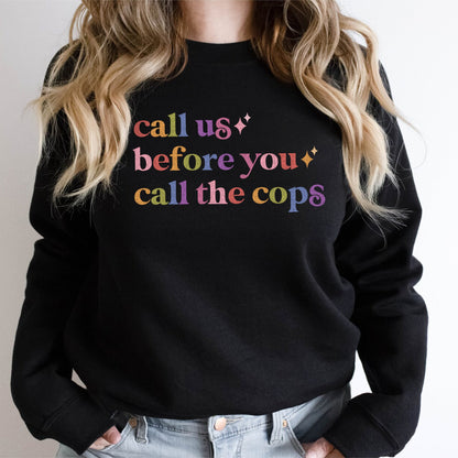 Call Us Before You Call the Cops Care & Resist Gildan crewneck sweatshirt in Black