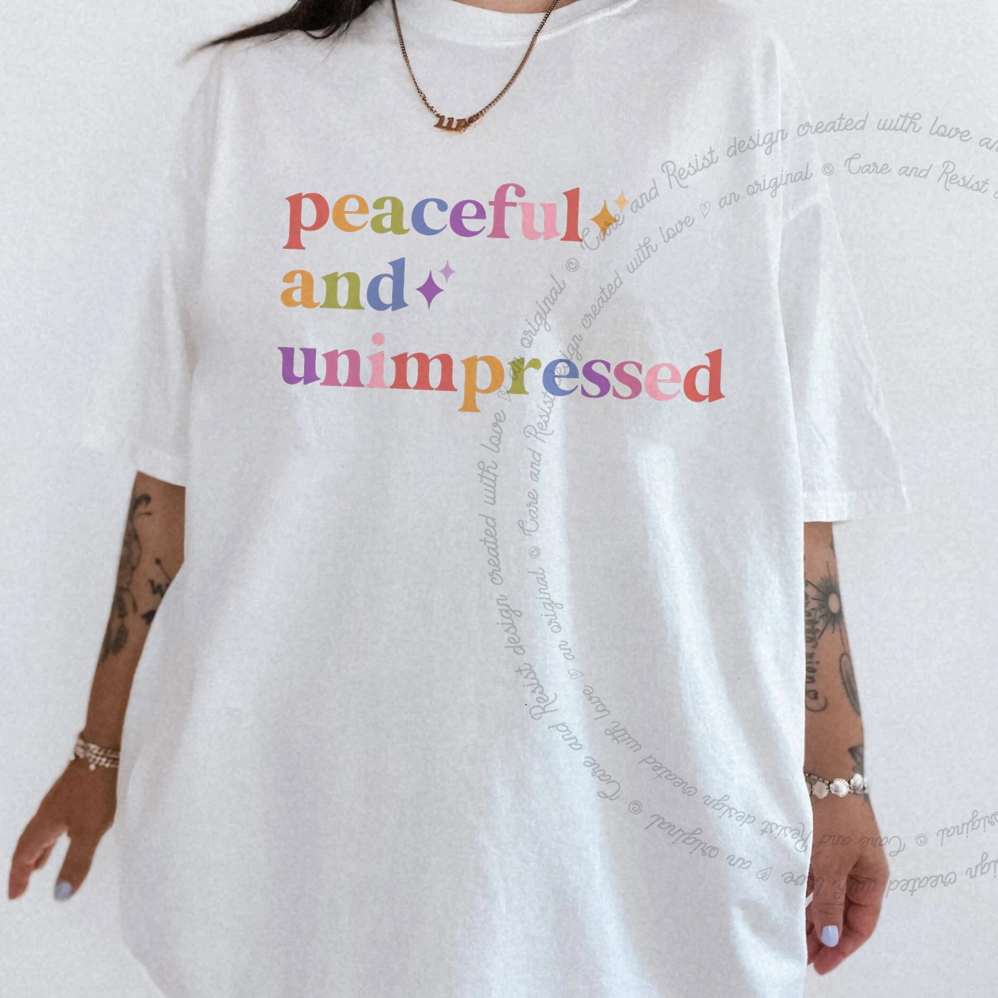 Peaceful and Unimpressed Care & Resist rainbow tee