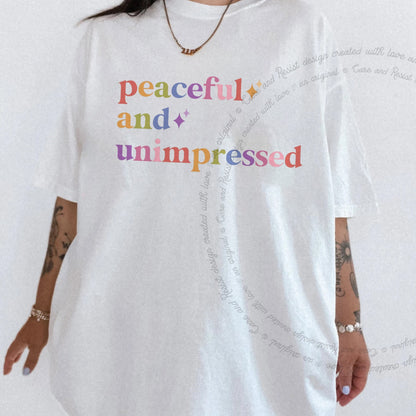Peaceful and Unimpressed Care & Resist rainbow tee