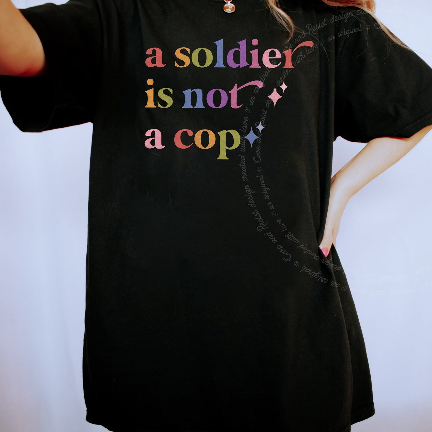 A Soldier is not a Cop Care & Resist rainbow tee