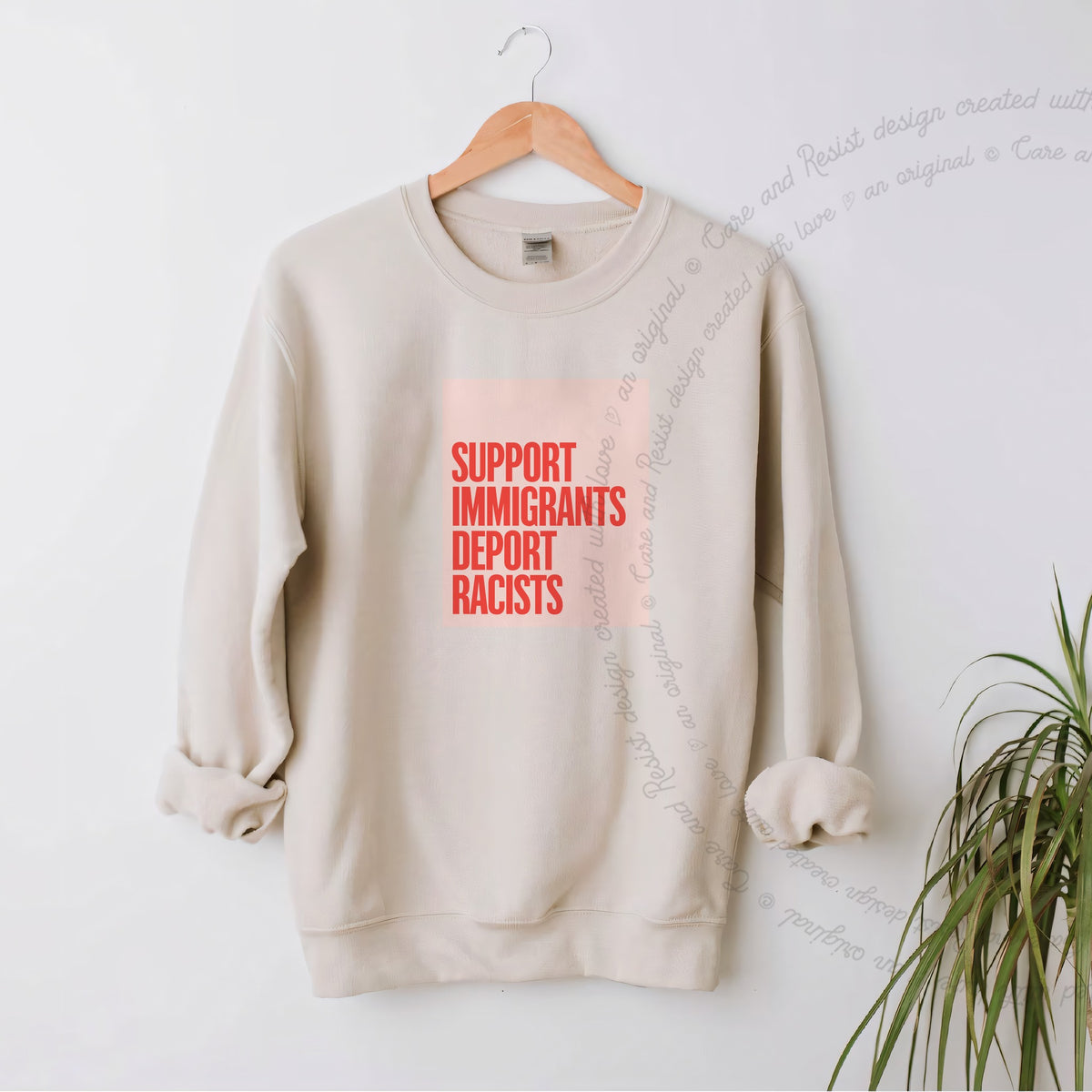 Support Immigrants Deport Racists Care & Resist Gildan crewneck sweatshirt in Sand