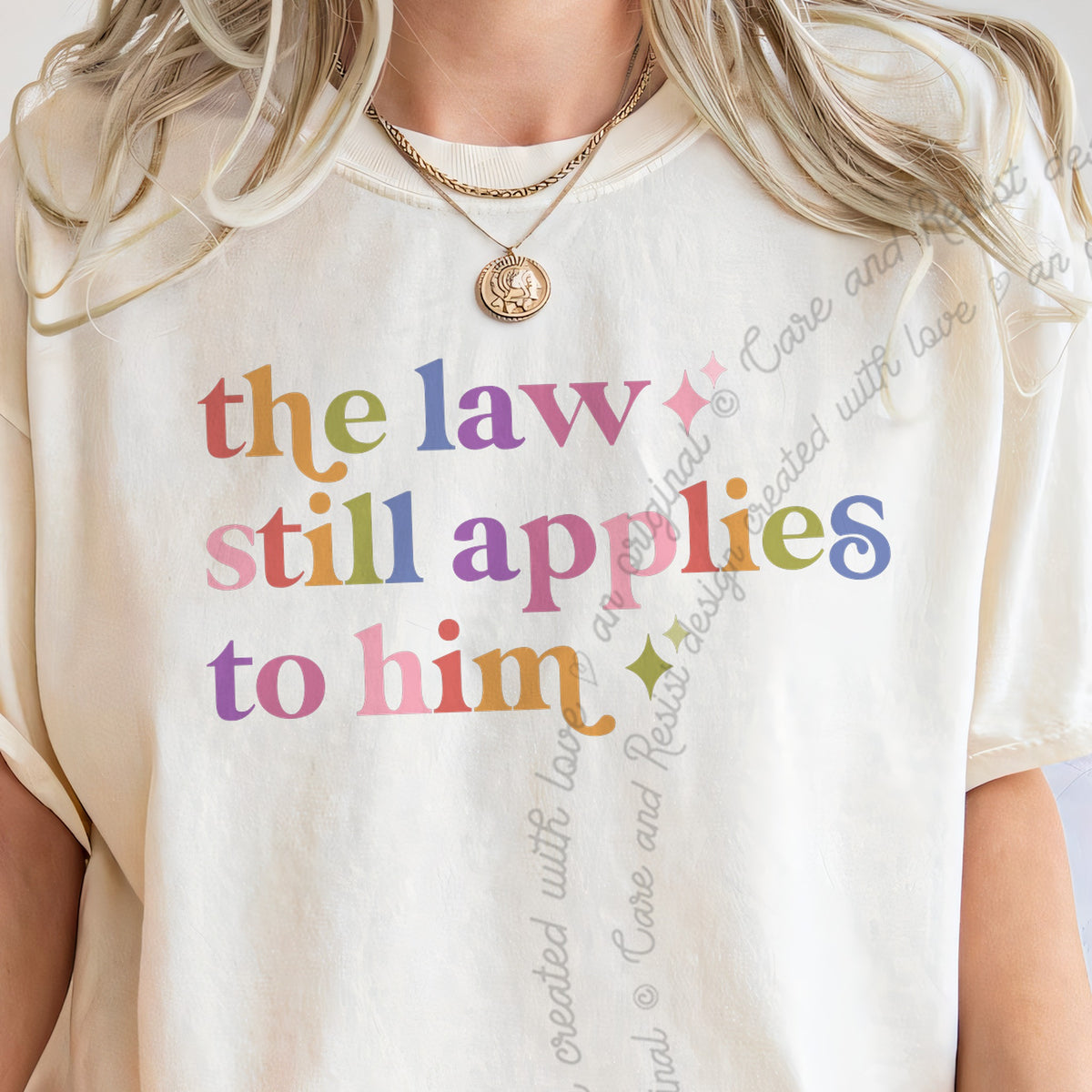 The Law Still Applies to Him Care & Resist progressive t-shirt in Ivory