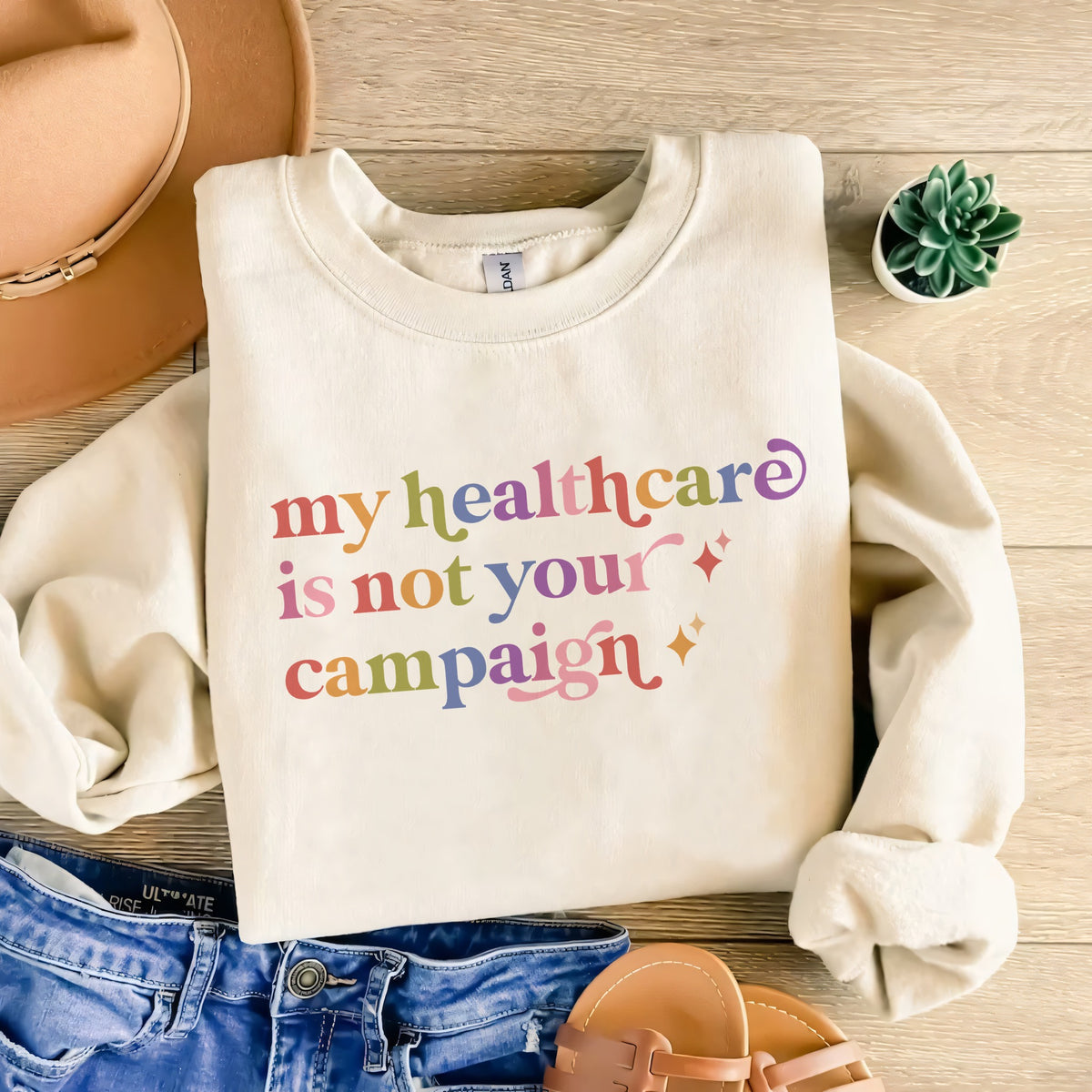 My Healthcare is not Your Campaign Care & Resist Gildan crewneck sweatshirt in Sand
