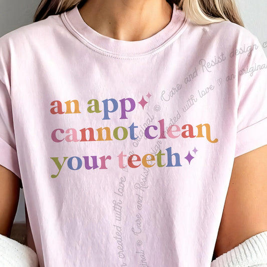 An App Cannot Clean Your Teeth Care & Resist tee in Blossom, close-up of the lettering