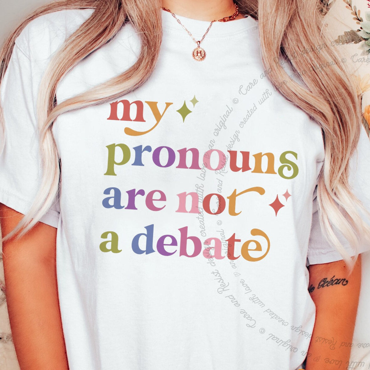 My Pronouns are not a Debate Care & Resist tee in White