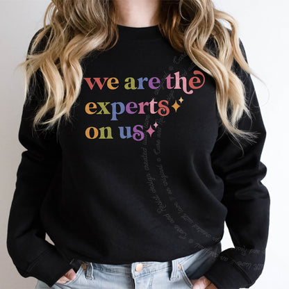 We are the Experts on Us Care & Resist Gildan crewneck sweatshirt in Black