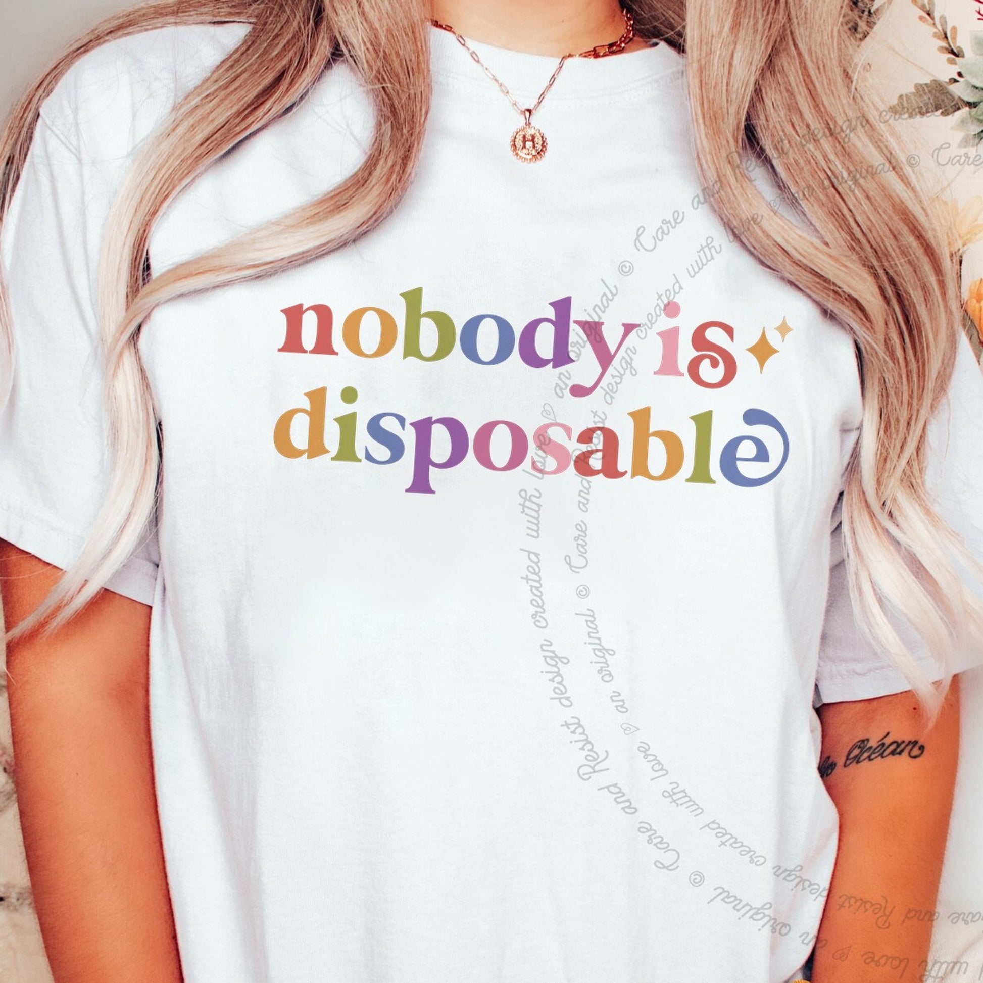 Nobody is Disposable Care & Resist rainbow tee