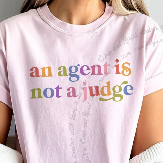 An Agent is not a Judge Care & Resist progressive t-shirt in Blossom