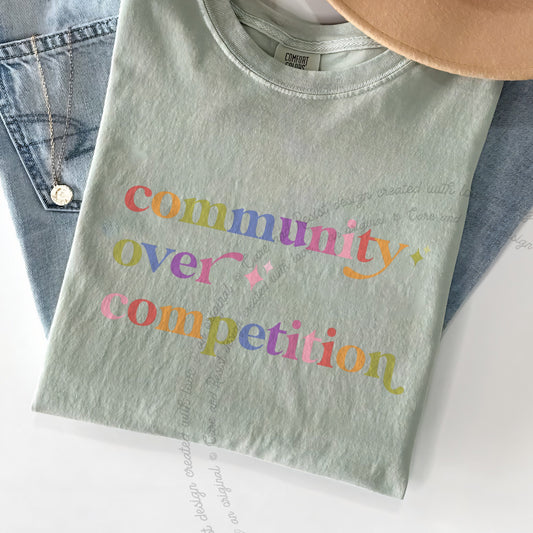 Community Over Competition Care & Resist progressive t-shirt in Bay