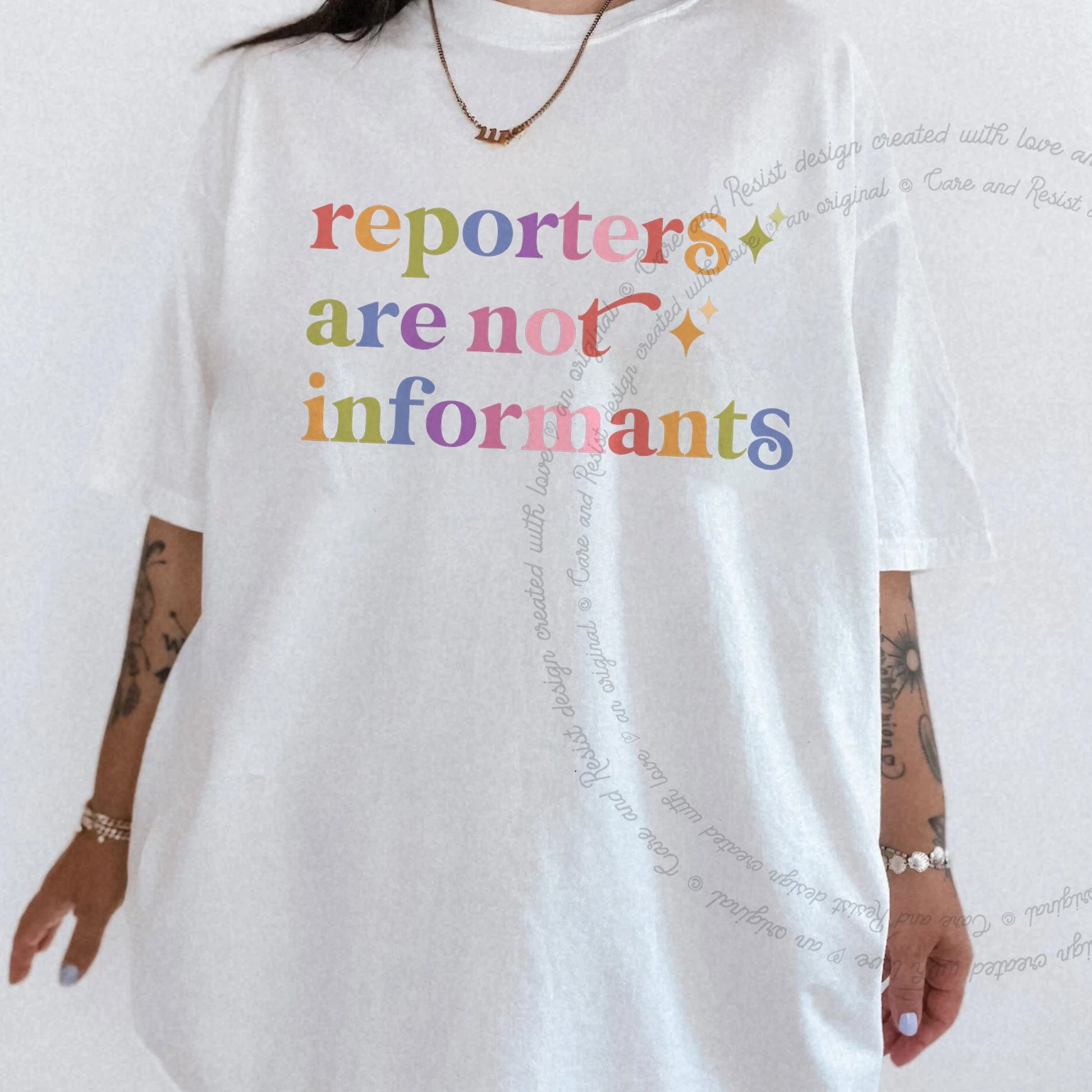 Reporters are not Informants Care & Resist rainbow tee