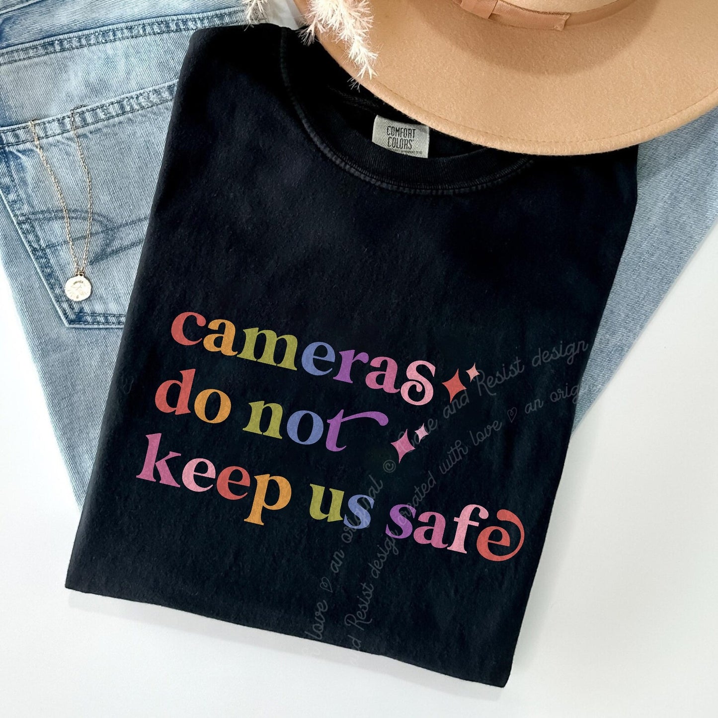 Cameras Do not Keep Us Safe Care & Resist rainbow Comfort Colors tee, Black