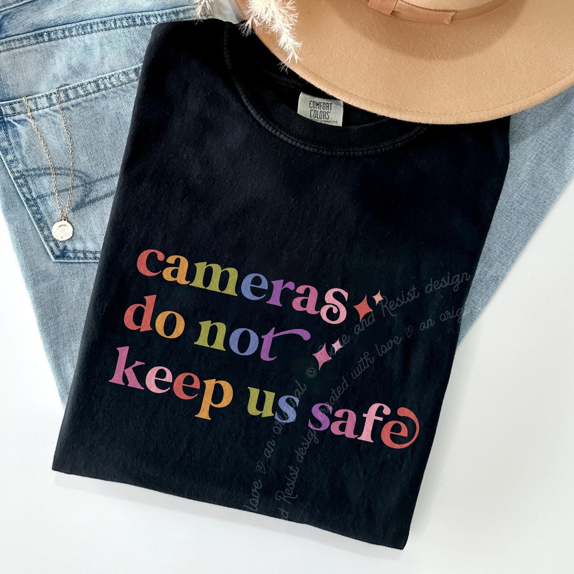 Cameras Do not Keep Us Safe Care & Resist rainbow Comfort Colors tee, Black