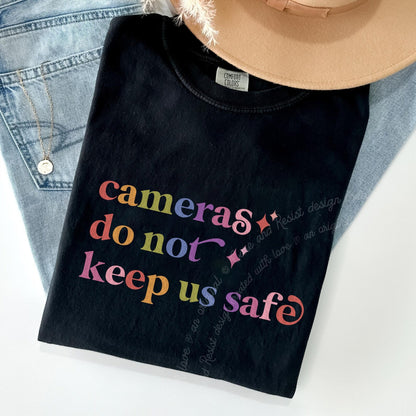 Cameras Do not Keep Us Safe Care & Resist rainbow Comfort Colors tee, Black