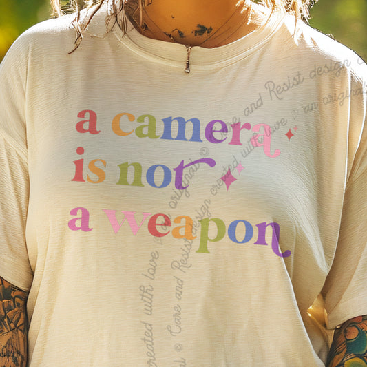 A Camera is not a Weapon Care & Resist progressive t-shirt in Ivory