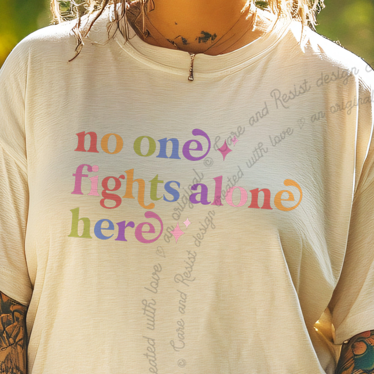No One Fights Alone Here Care & Resist progressive t-shirt in Ivory