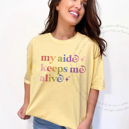 My Aide Keeps Me Alive Care & Resist rainbow Comfort Colors tee, Banana