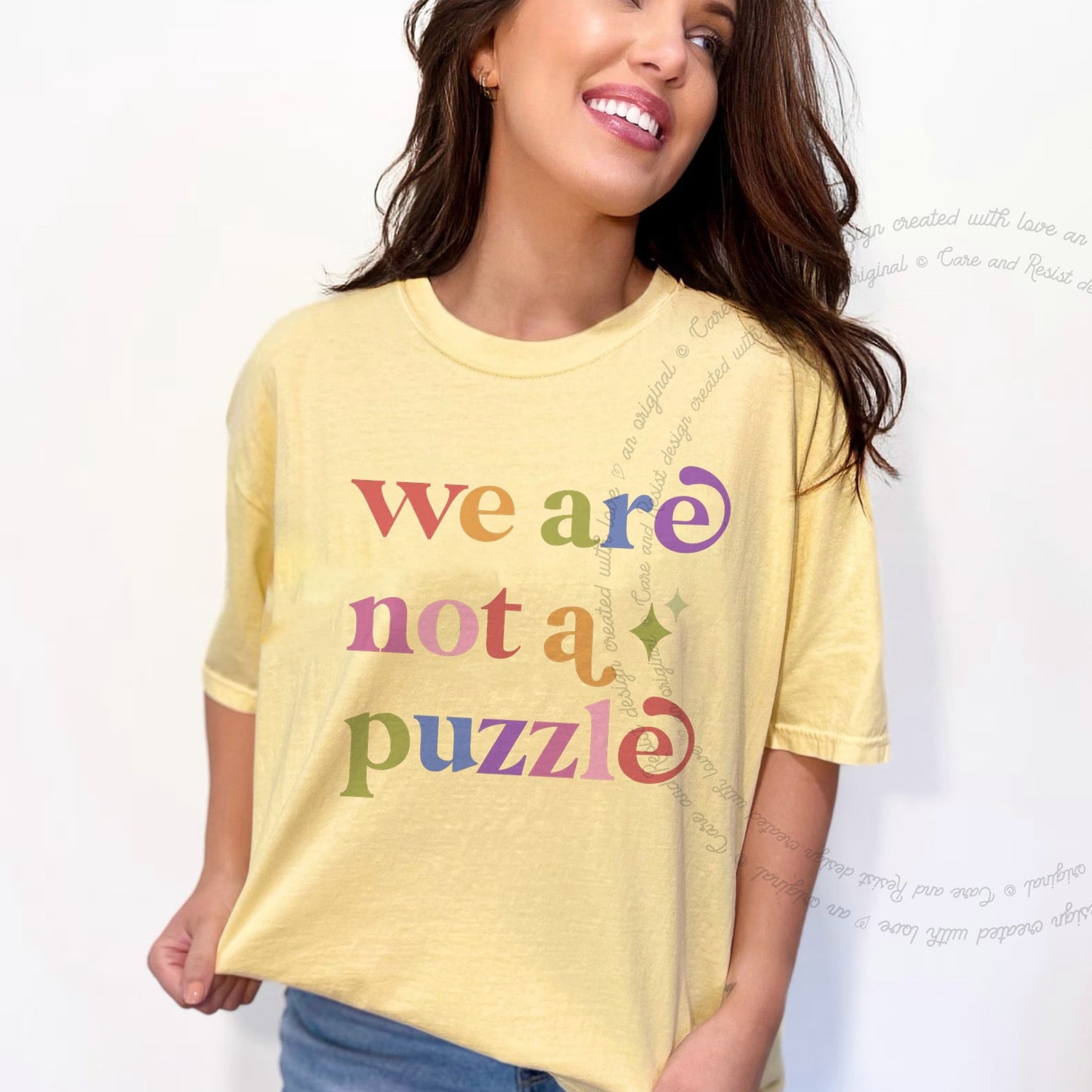 We are not a Puzzle Care & Resist rainbow tee
