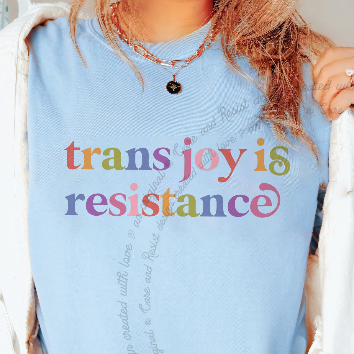 Trans Joy is Resistance Care & Resist progressive t-shirt in Chambray