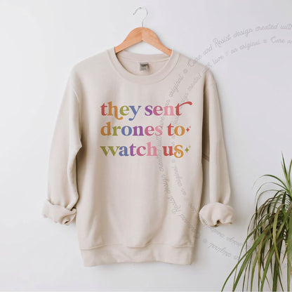 They Sent Drones to Watch Us Care & Resist Gildan crewneck sweatshirt in Sand