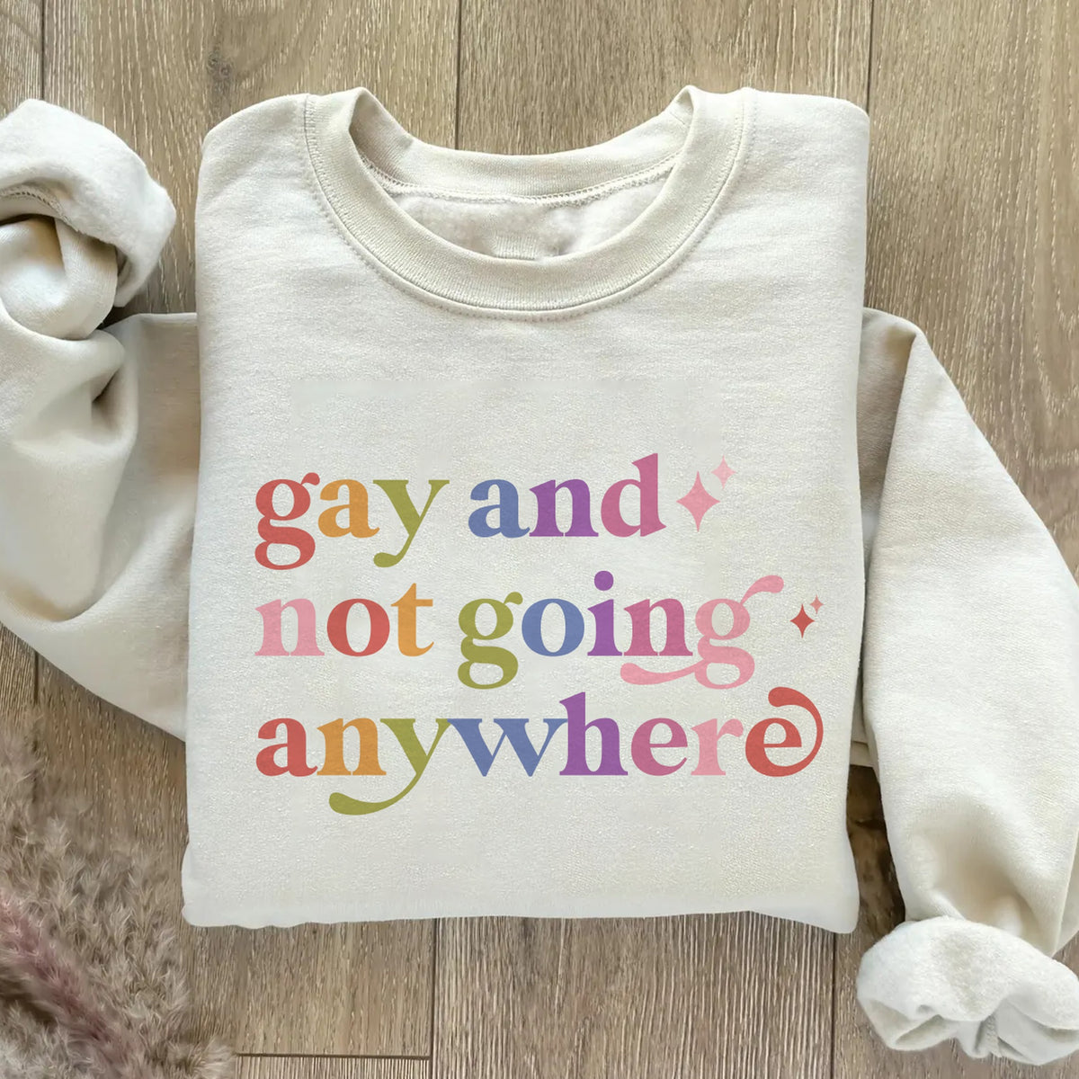 Gay and not Going Anywhere Care & Resist Gildan crewneck sweatshirt in Sand