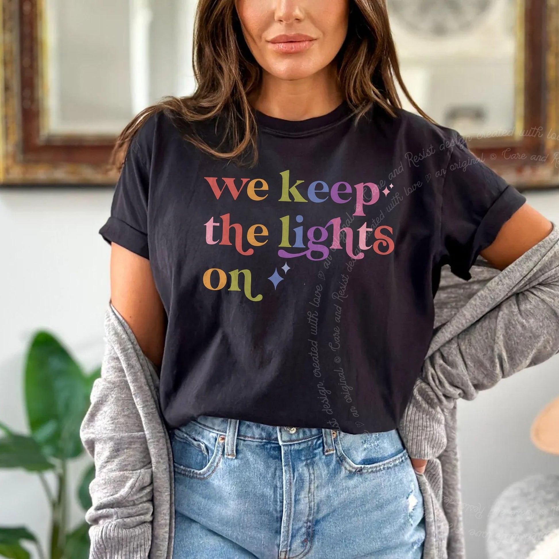We Keep the Lights on Care & Resist rainbow Comfort Colors tee, Black
