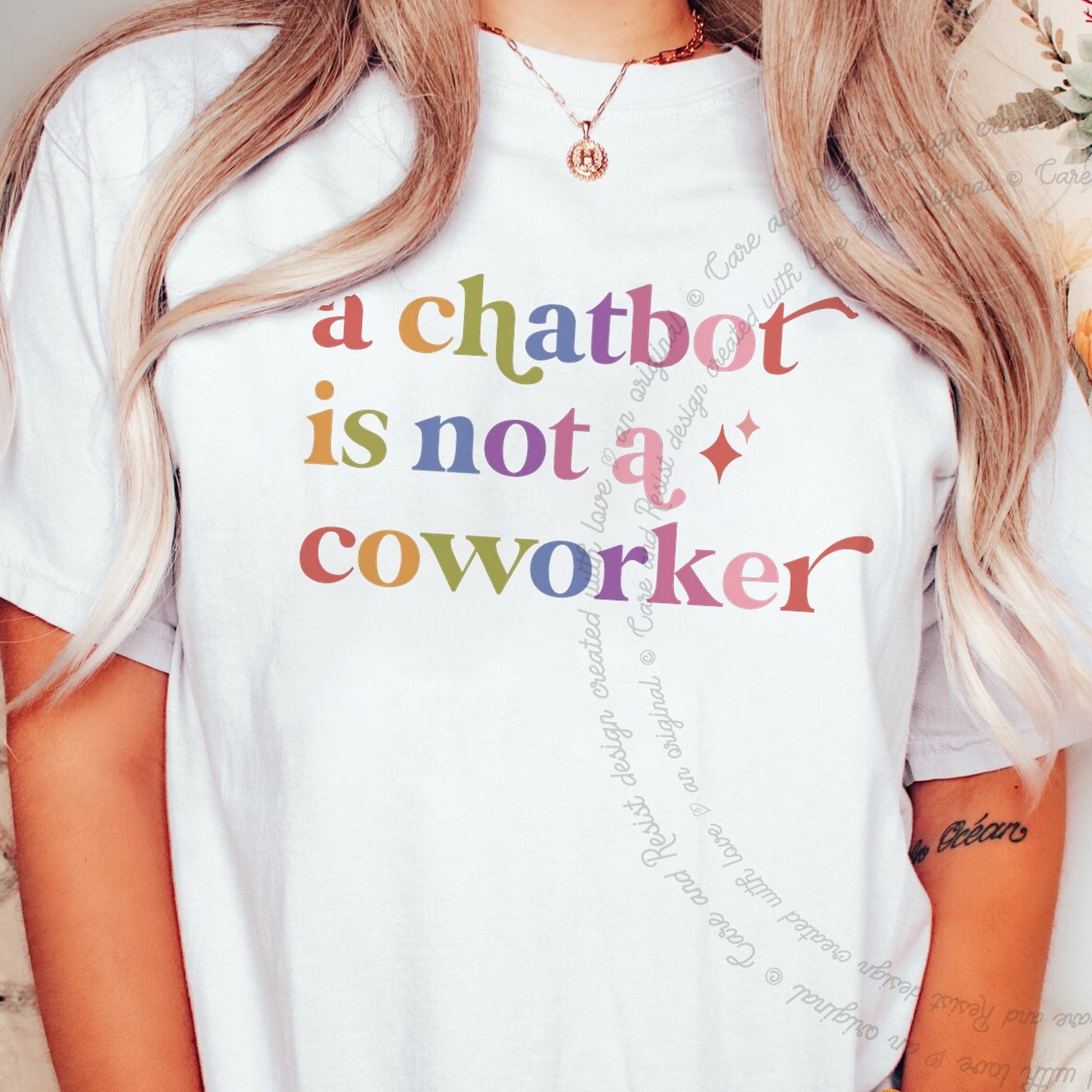 A Chatbot is not a Coworker Care & Resist rainbow tee