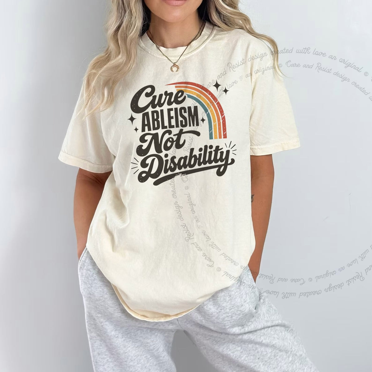 Cure Ableism not Disability Badge Care & Resist progressive t-shirt in Ivory