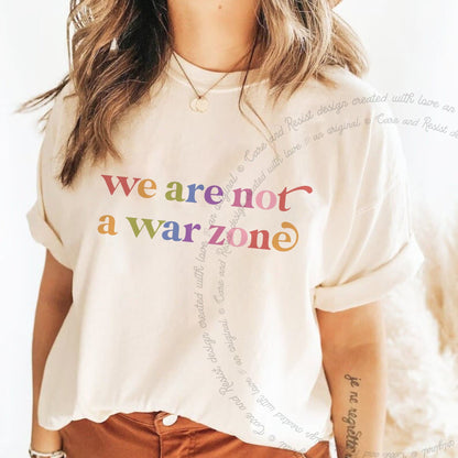 We are not a War Zone Care & Resist rainbow tee