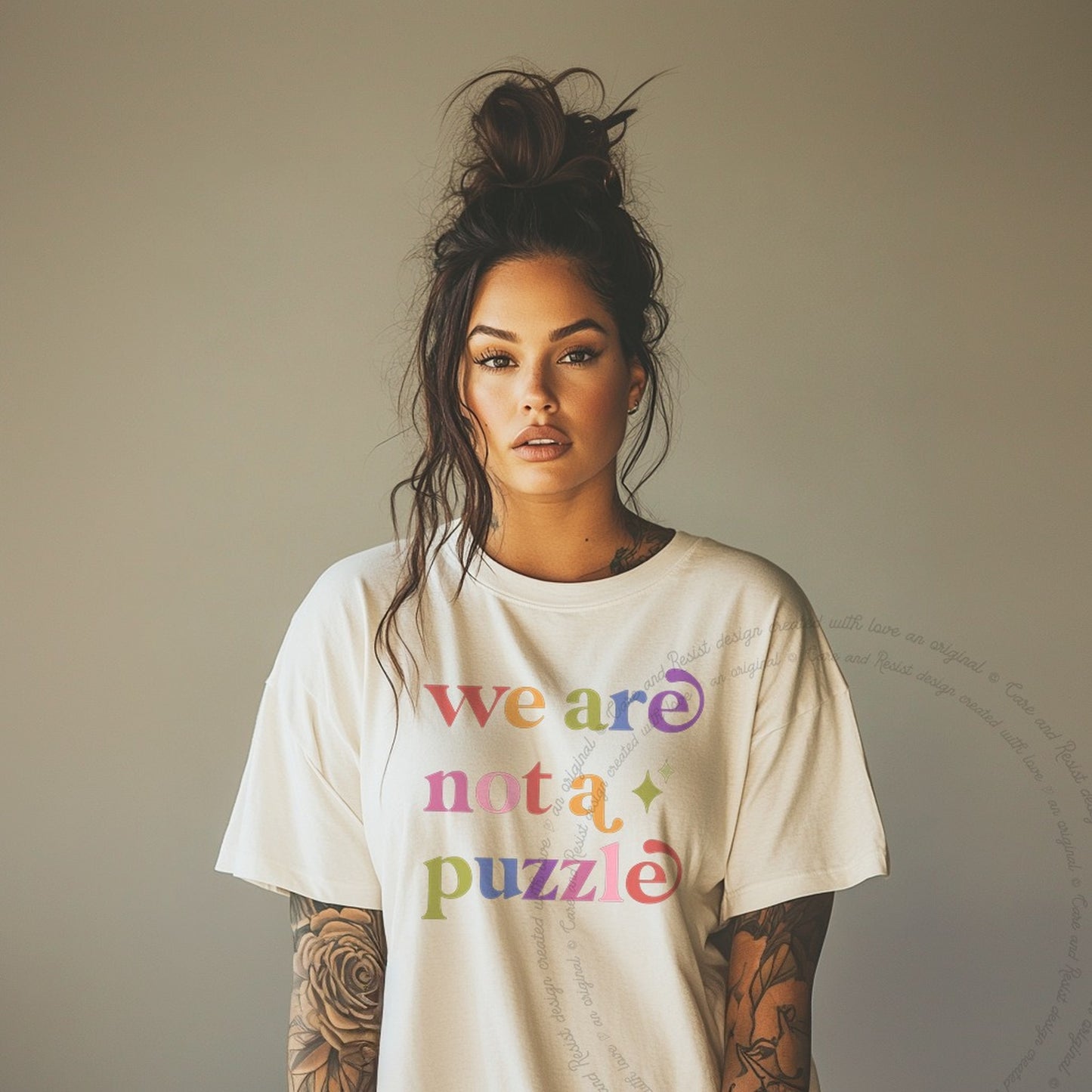 We are not a Puzzle Care & Resist rainbow tee