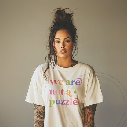 We are not a Puzzle Care & Resist rainbow tee