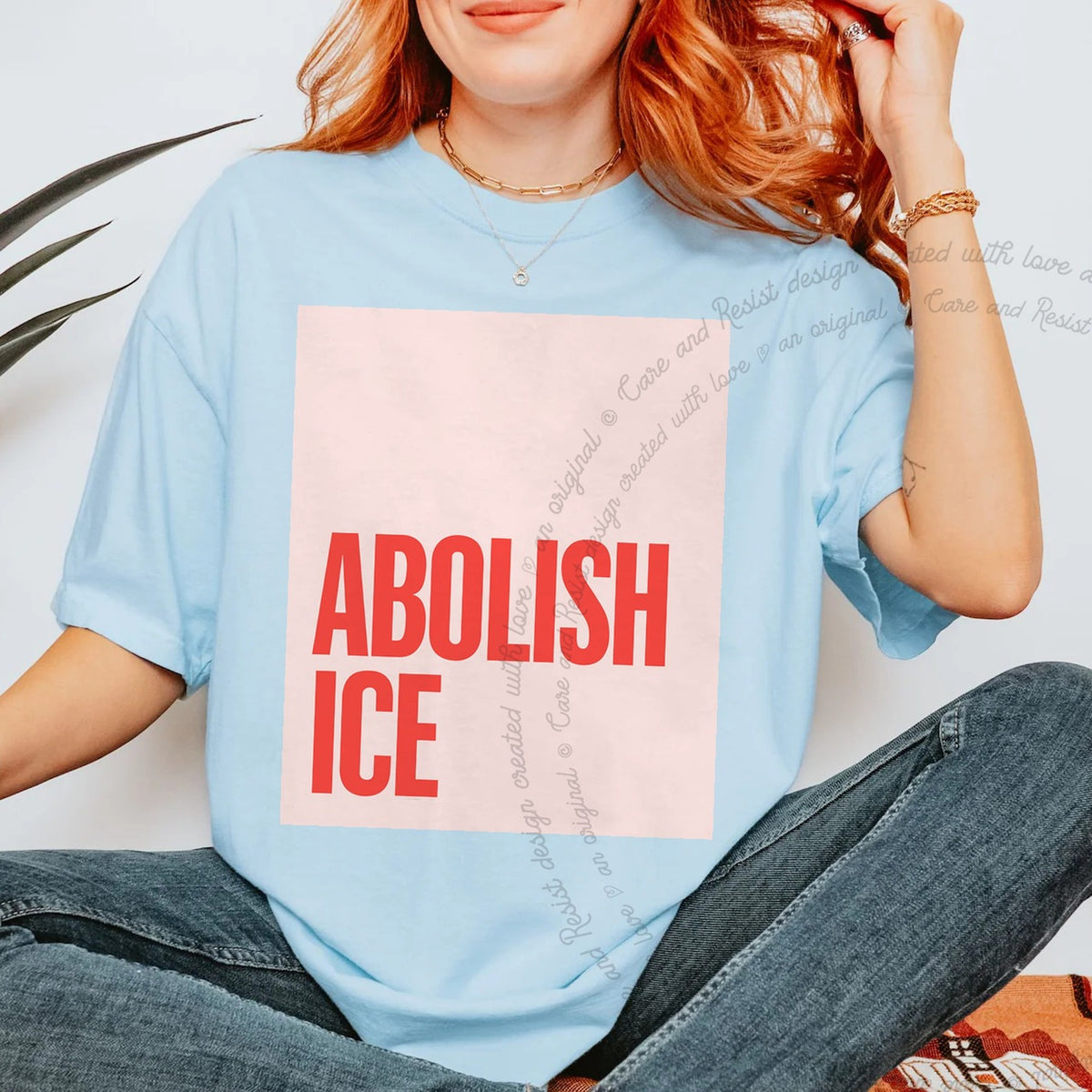 Abolish ICE Care & Resist progressive t-shirt in Chambray