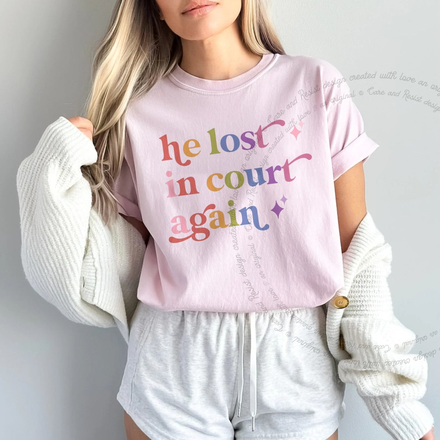 He Lost in Court Again Care & Resist rainbow Comfort Colors tee, Blossom