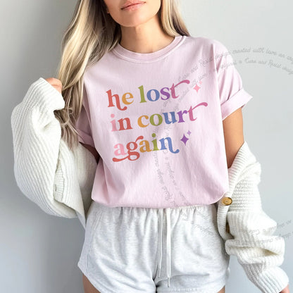 He Lost in Court Again Care & Resist rainbow Comfort Colors tee, Blossom