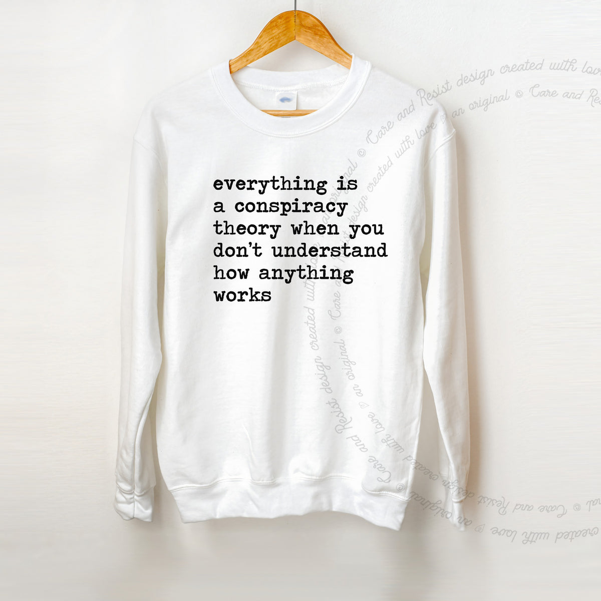 Everything Is a Conspiracy Theory When You Don't Understand How Anything Works Care & Resist Gildan crewneck sweatshirt in White
